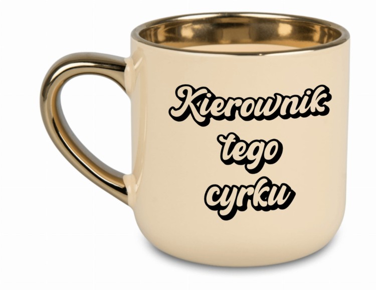 "Kierownik tego cyrku": "Humorystyczny kubek 'Kierownik tego cyrku' w kolorze kremowym z złotym uchem"