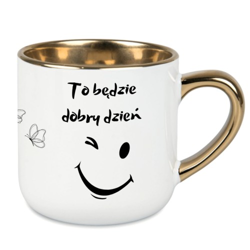 Biały kubek z napisem „To będzie dobry dzień” i złotym uchem