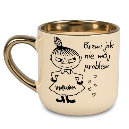 kremowy kubek ze złotym rantem i uchem z Małą Mi i napisem brzmi jak nie mój problem