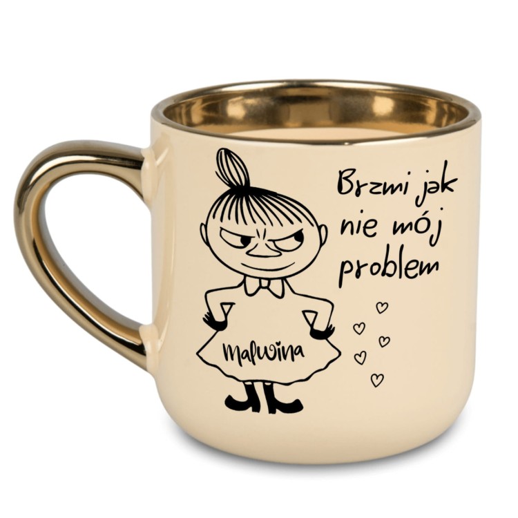 kremowy kubek ze złotym rantem i uchem z Małą Mi i napisem brzmi jak nie mój problem