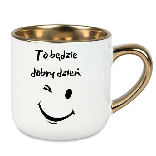 Śnieżnobiały kubek ze złotym uchem i pozytywnym hasłem na dobry dzień